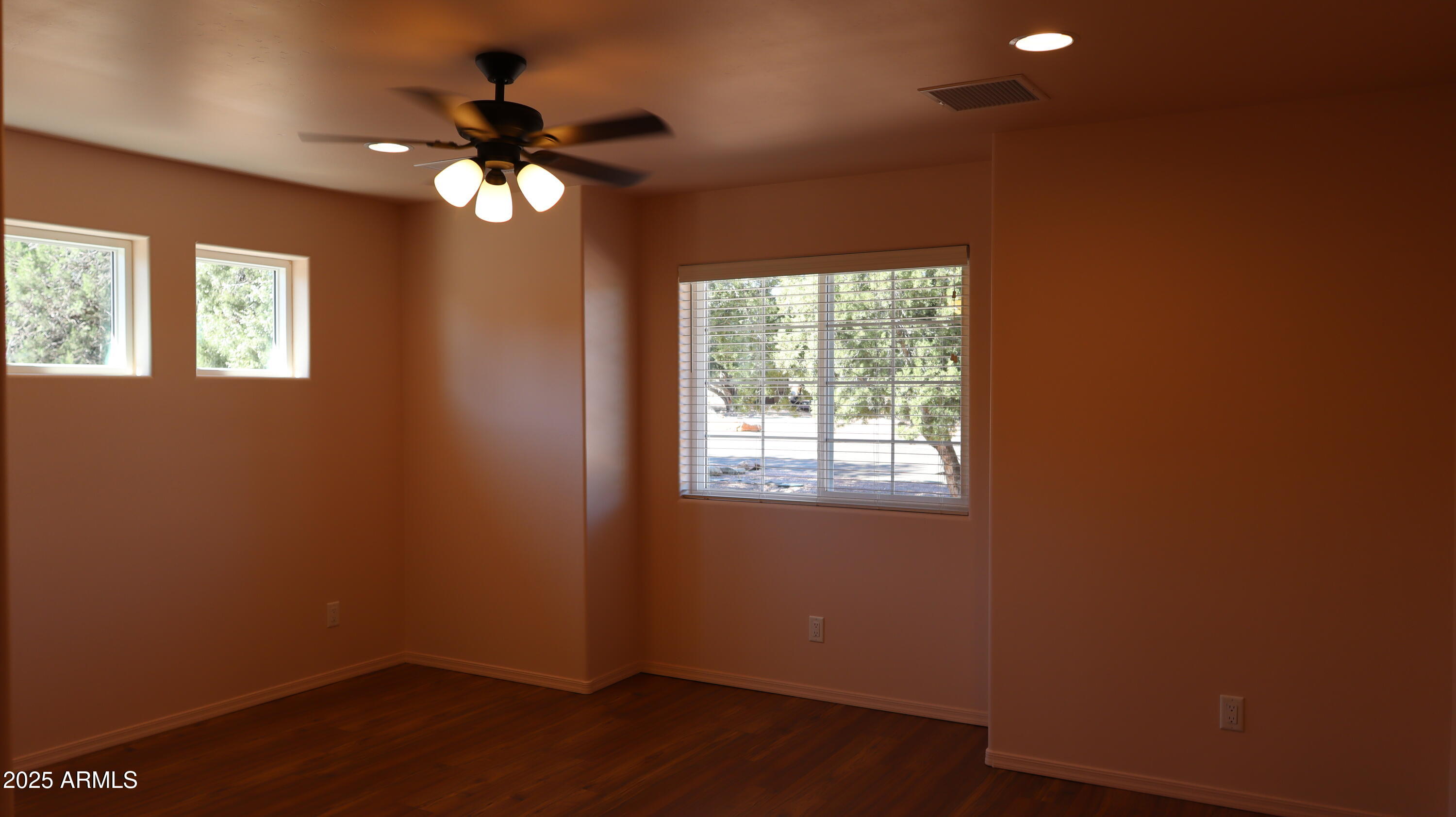 1701 West Dillon Way Payson, AZ 85541 - Photo 57 of 83 a view of empty room with wooden floor and fan