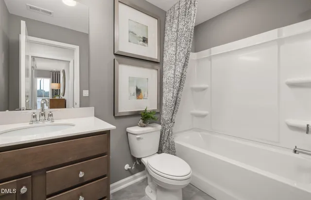 a bathroom with a sink a toilet and a bathtub