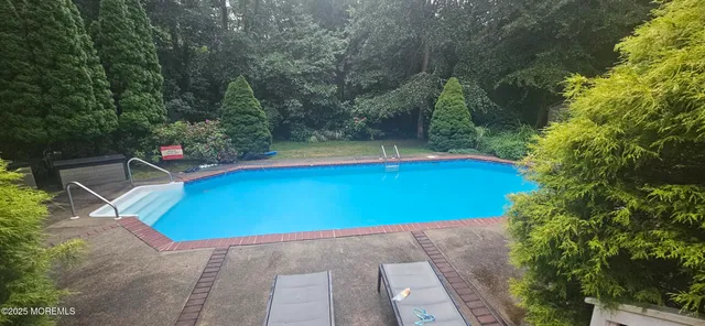 a view of a deck with wooden floor and outdoor seating