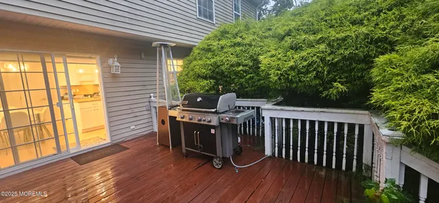 a view of a dining room with furniture and a chandelier