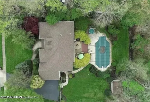 an aerial view of a house with a garden