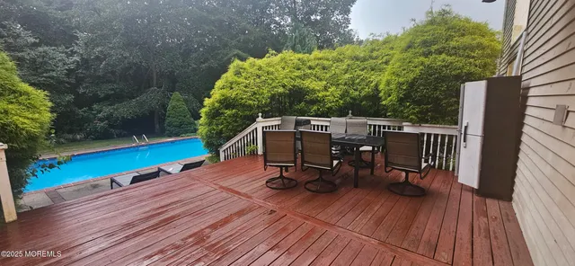 a kitchen with granite countertop a stove a sink and a refrigerator