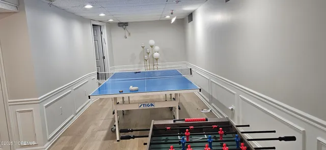 a bedroom with two beds and a night stand