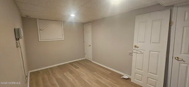 a living room with furniture and a ceiling fan