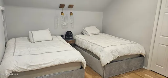 a bathroom with double vanity sink and a mirror