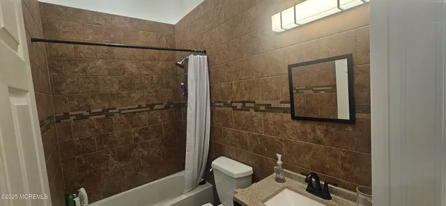 a bathroom with a double vanity sink and mirror