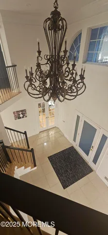 a bedroom with two beds and painted walls