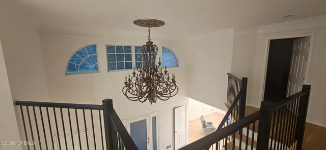 a bedroom with a bed and ceiling fan