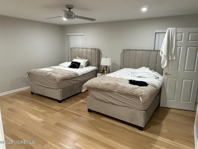 a backyard of a house with lots of plants and trees