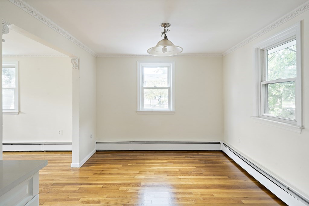 43 George Road, Unit 43 Winchester, MA 01890 - Photo 13 of 19 a view of a room with wooden floor and window