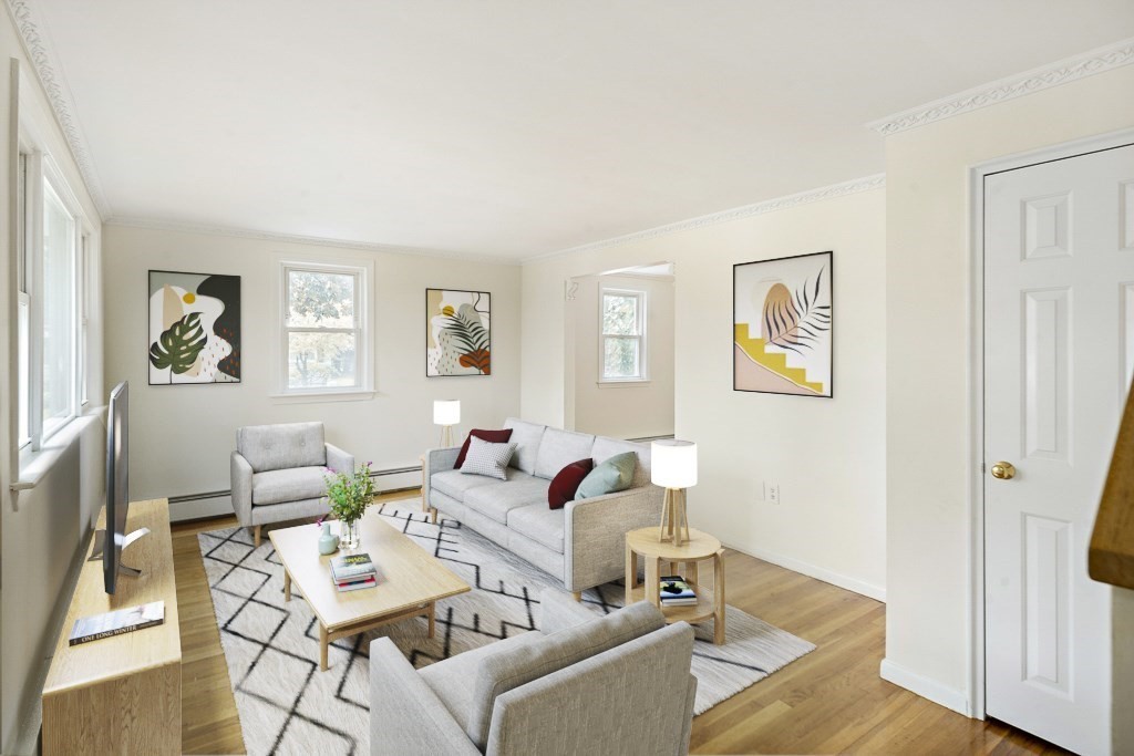 43 George Road, Unit 43 Winchester, MA 01890 - Photo 2 of 19 a living room with furniture and a window