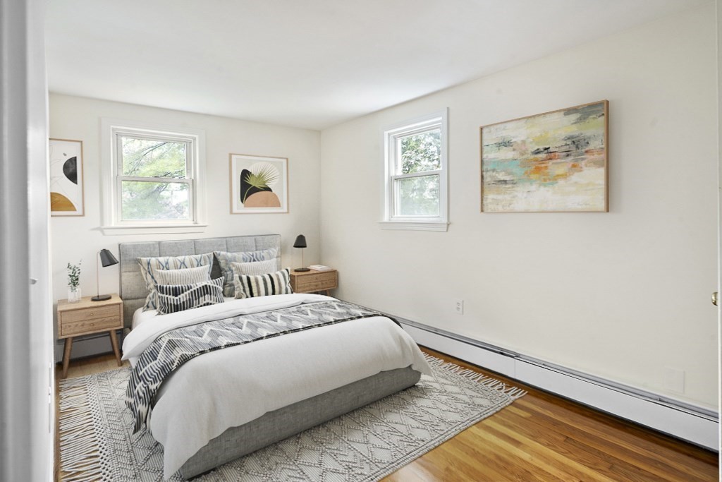 43 George Road, Unit 43 Winchester, MA 01890 - Photo 4 of 19 a bedroom with a bed and a window