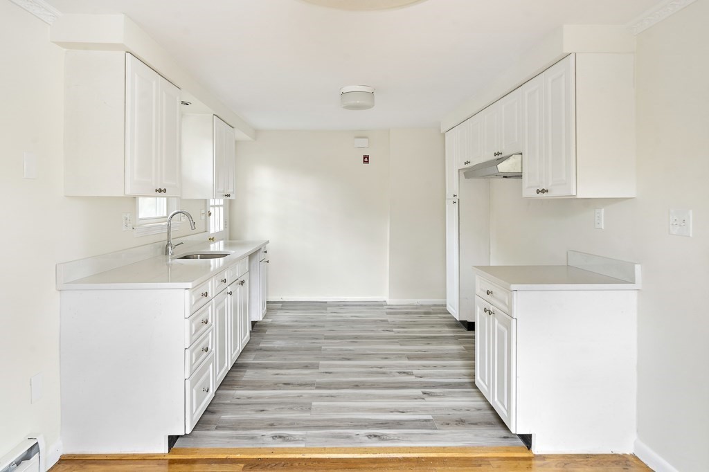 43 George Road, Unit 43 Winchester, MA 01890 - Photo 6 of 19 a hallway with cabinets