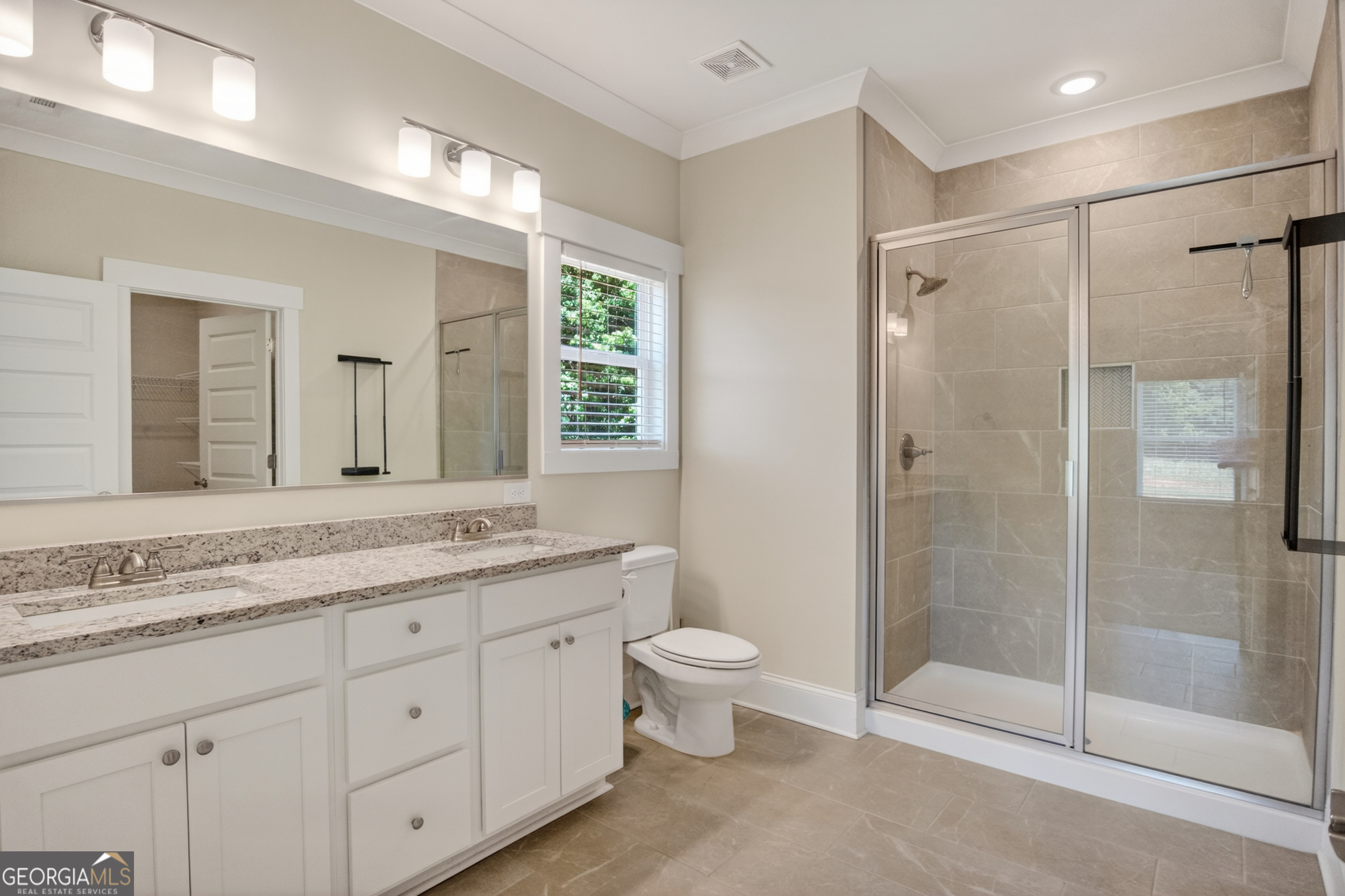 1350-c O Draper Road Comer, GA 30629 - Photo 37 of 47 a bathroom with a granite countertop sink a toilet and shower