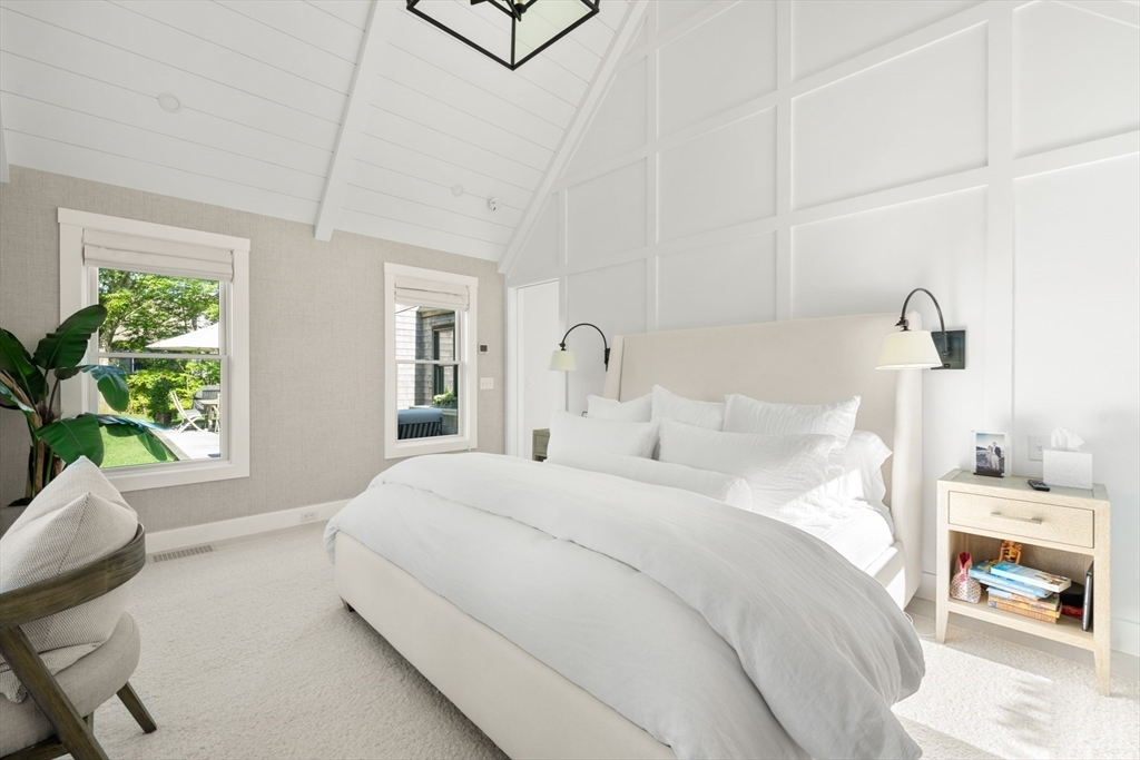 1 Doc Ryder Drive Nantucket, MA 02554 - Photo 19 of 42 a bedroom with a bed and a potted plant on the dresser