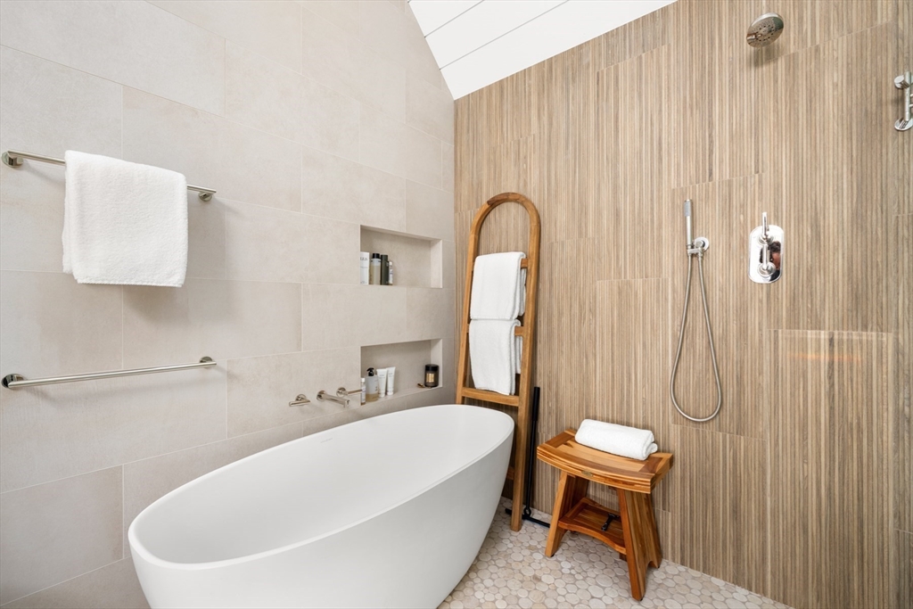 1 Doc Ryder Drive Nantucket, MA 02554 - Photo 20 of 42 a white bath tub sitting next to a white sink and a bathroom