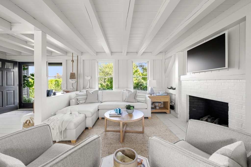 1 Doc Ryder Drive Nantucket, MA 02554 - Photo 2 of 42 a living room with furniture fireplace and window