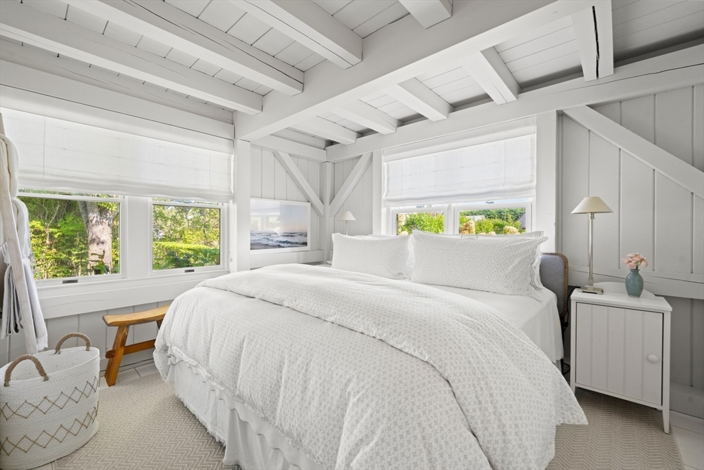 1 Doc Ryder Drive Nantucket, MA 02554 - Photo 23 of 42 a bedroom with a bed and a large window