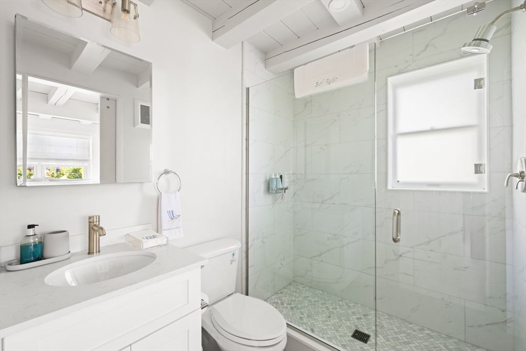 1 Doc Ryder Drive Nantucket, MA 02554 - Photo 24 of 42 a bathroom with a sink a toilet and shower