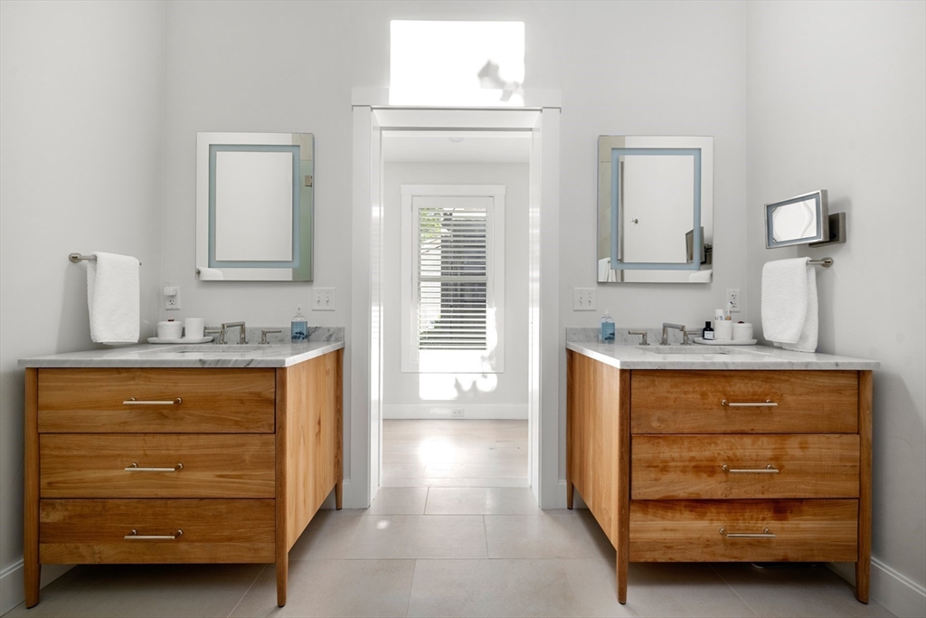 1 Doc Ryder Drive Nantucket, MA 02554 - Photo 29 of 42 a bathroom with a sink a vanity and mirror