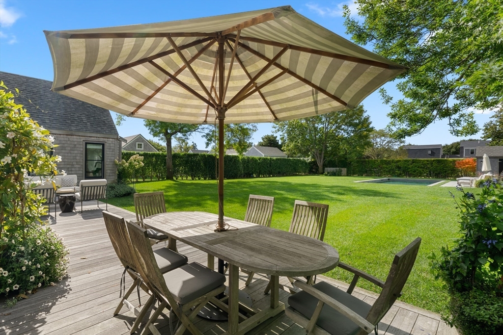 1 Doc Ryder Drive Nantucket, MA 02554 - Photo 30 of 42 a patio with swimming pool table and chairs