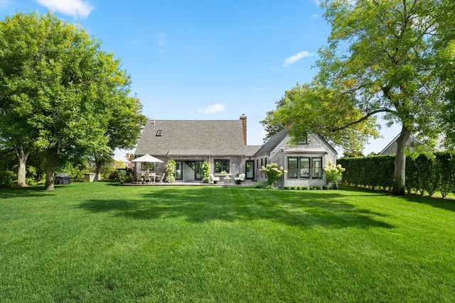 a view of house with swimming pool outdoor seating