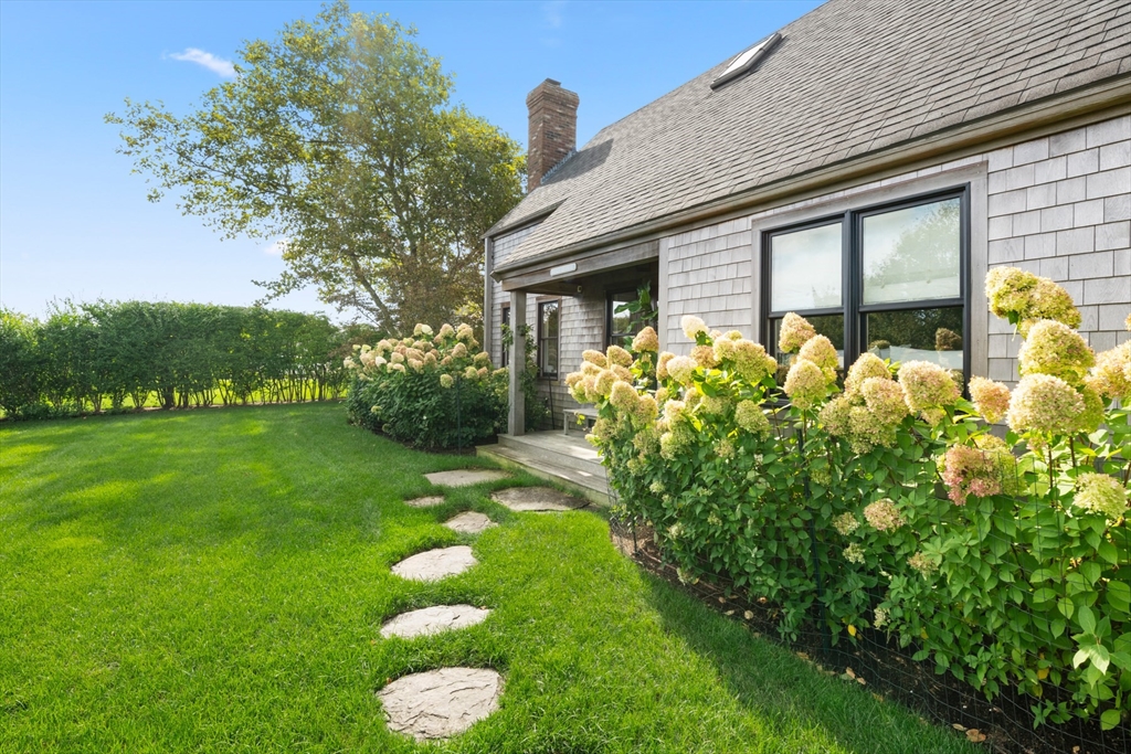 1 Doc Ryder Drive Nantucket, MA 02554 - Photo 40 of 42 a front view of a house with garden
