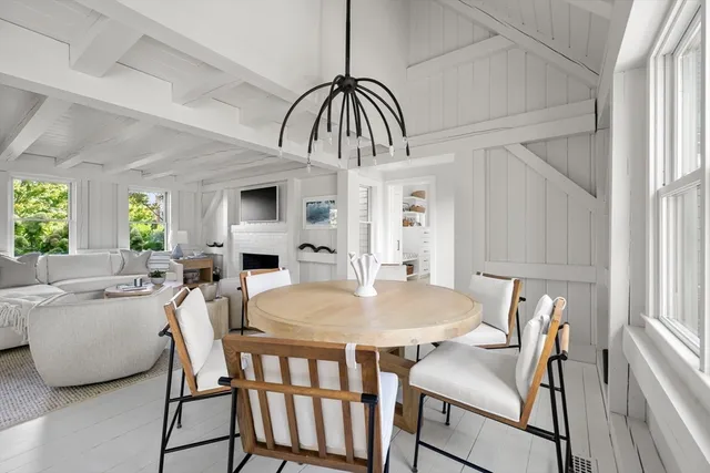 a view of a dining room with furniture and window
