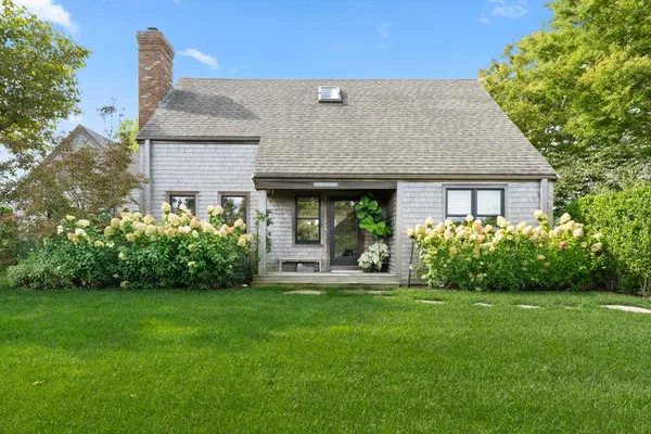 a house view with a garden space