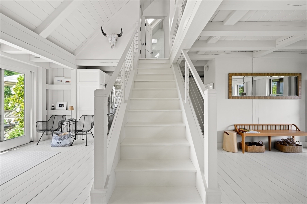 1 Doc Ryder Drive Nantucket, MA 02554 - Photo 8 of 42 a living room with furniture and a chandelier