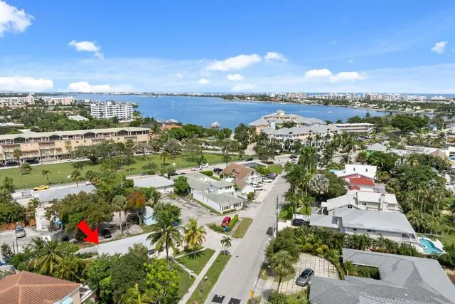 an aerial view of residential houses with city view
