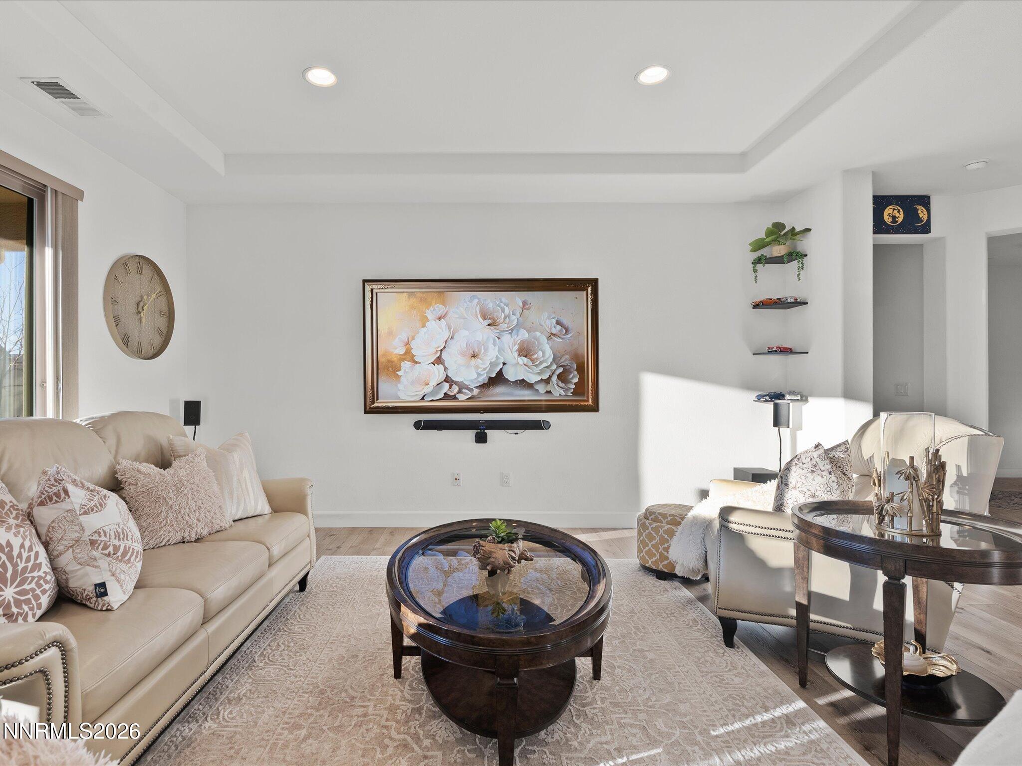 9803 Ash Meadow Drive Reno, NV 89521 - Photo 11 of 56 a living room with furniture a rug and a large window