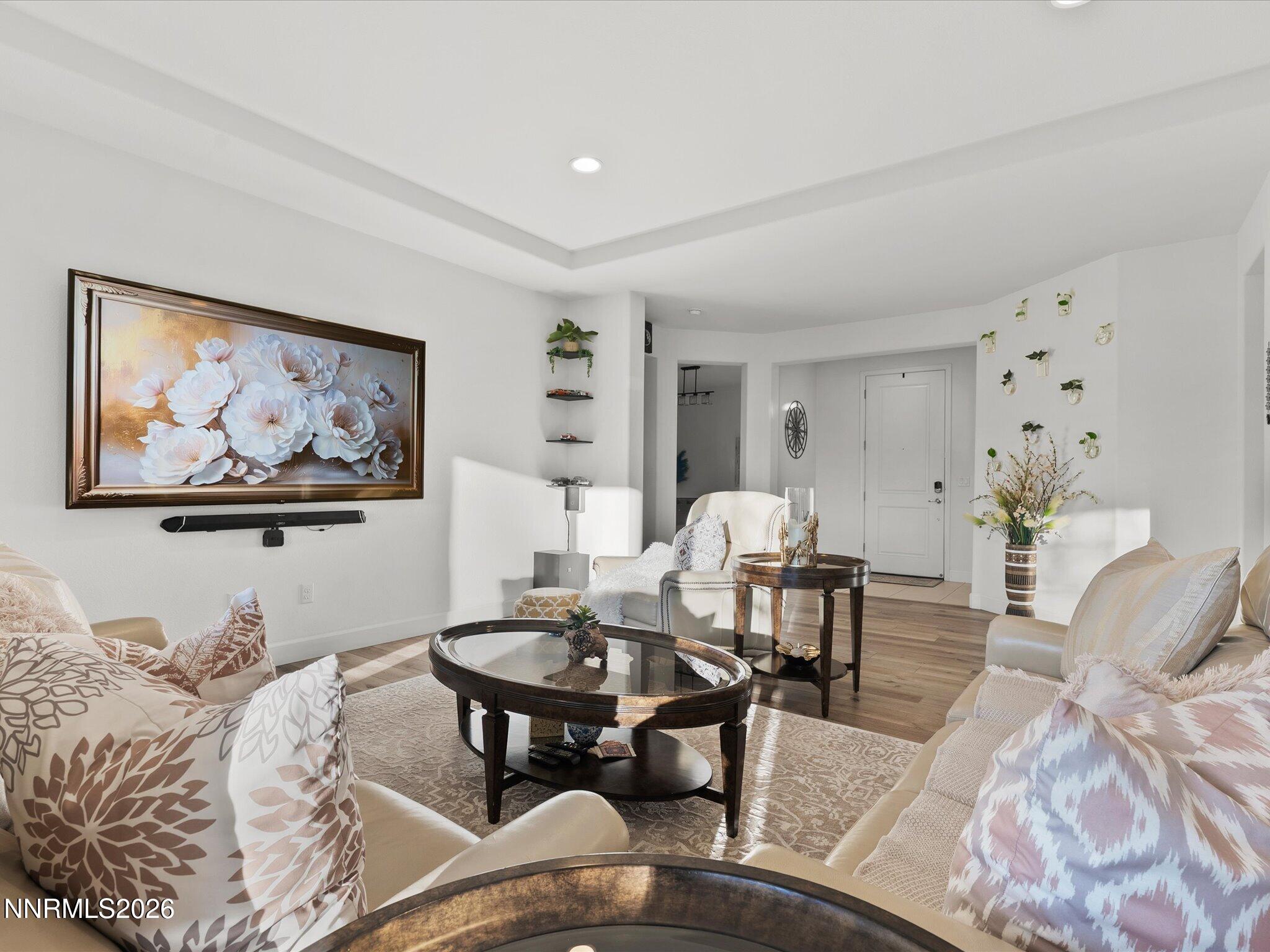 9803 Ash Meadow Drive Reno, NV 89521 - Photo 12 of 56 a living room with furniture a rug and a painting on the wall