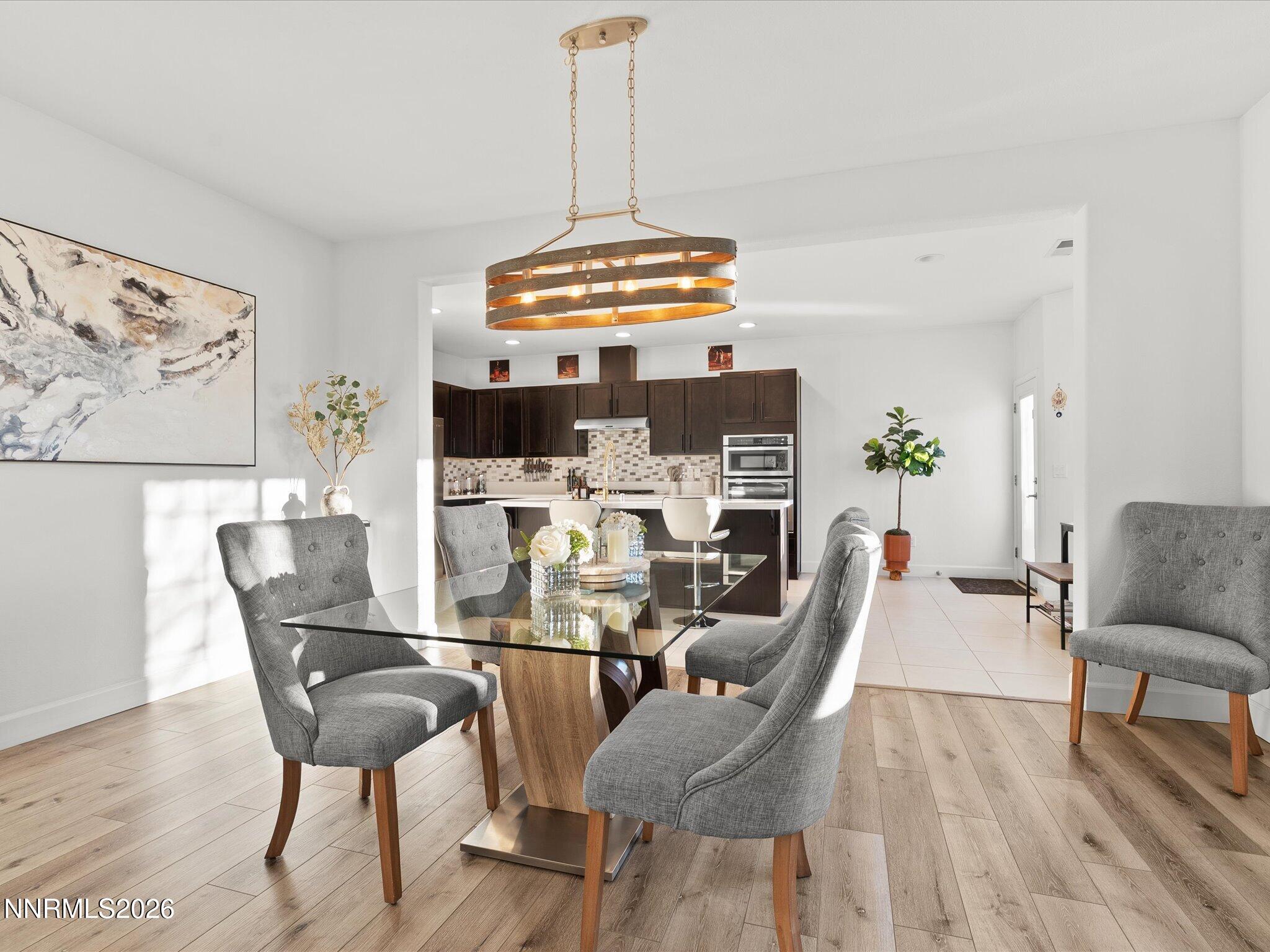 9803 Ash Meadow Drive Reno, NV 89521 - Photo 14 of 56 a dining room with furniture and wooden floor
