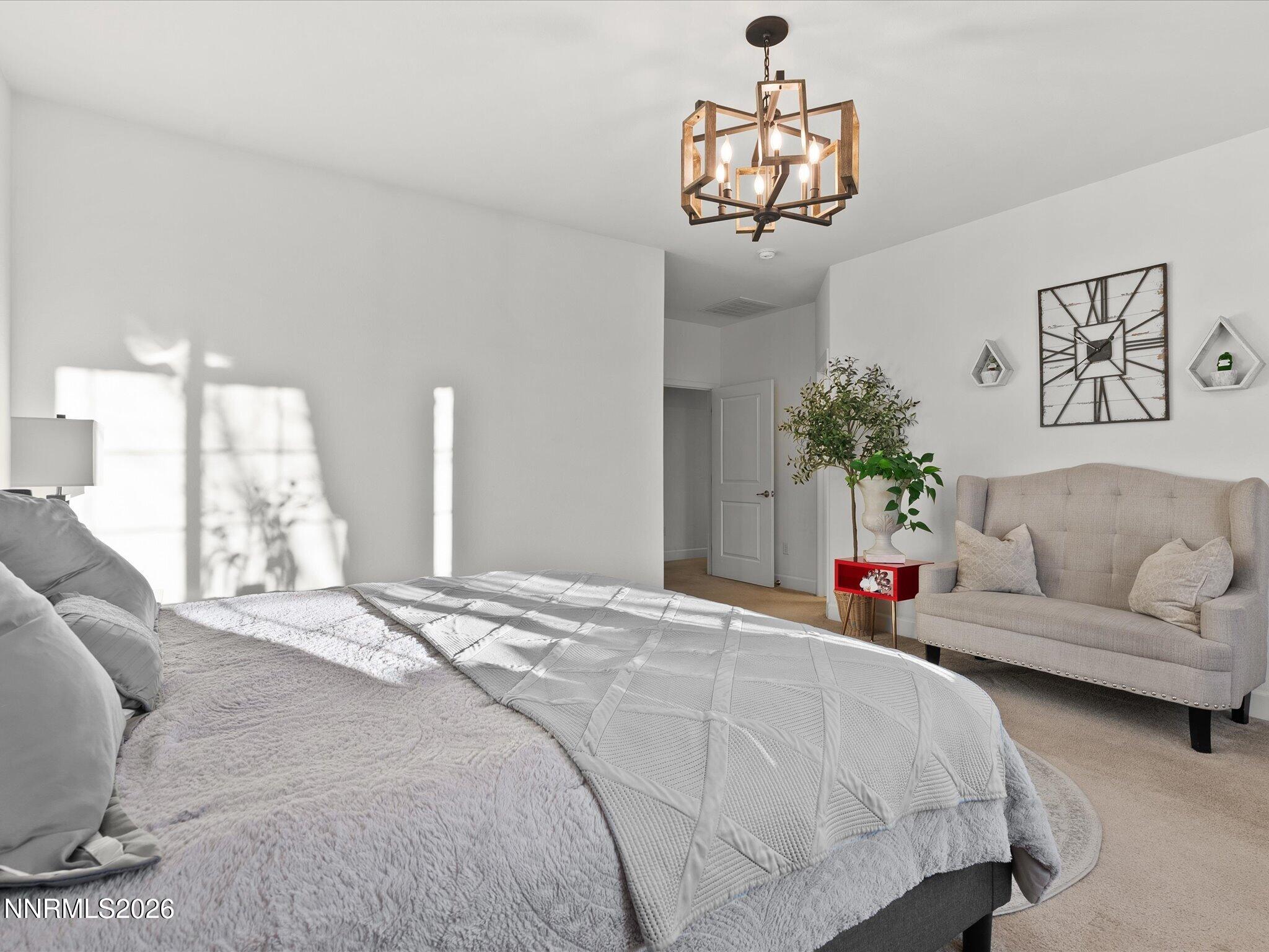 9803 Ash Meadow Drive Reno, NV 89521 - Photo 26 of 56 a bedroom with a bed and window