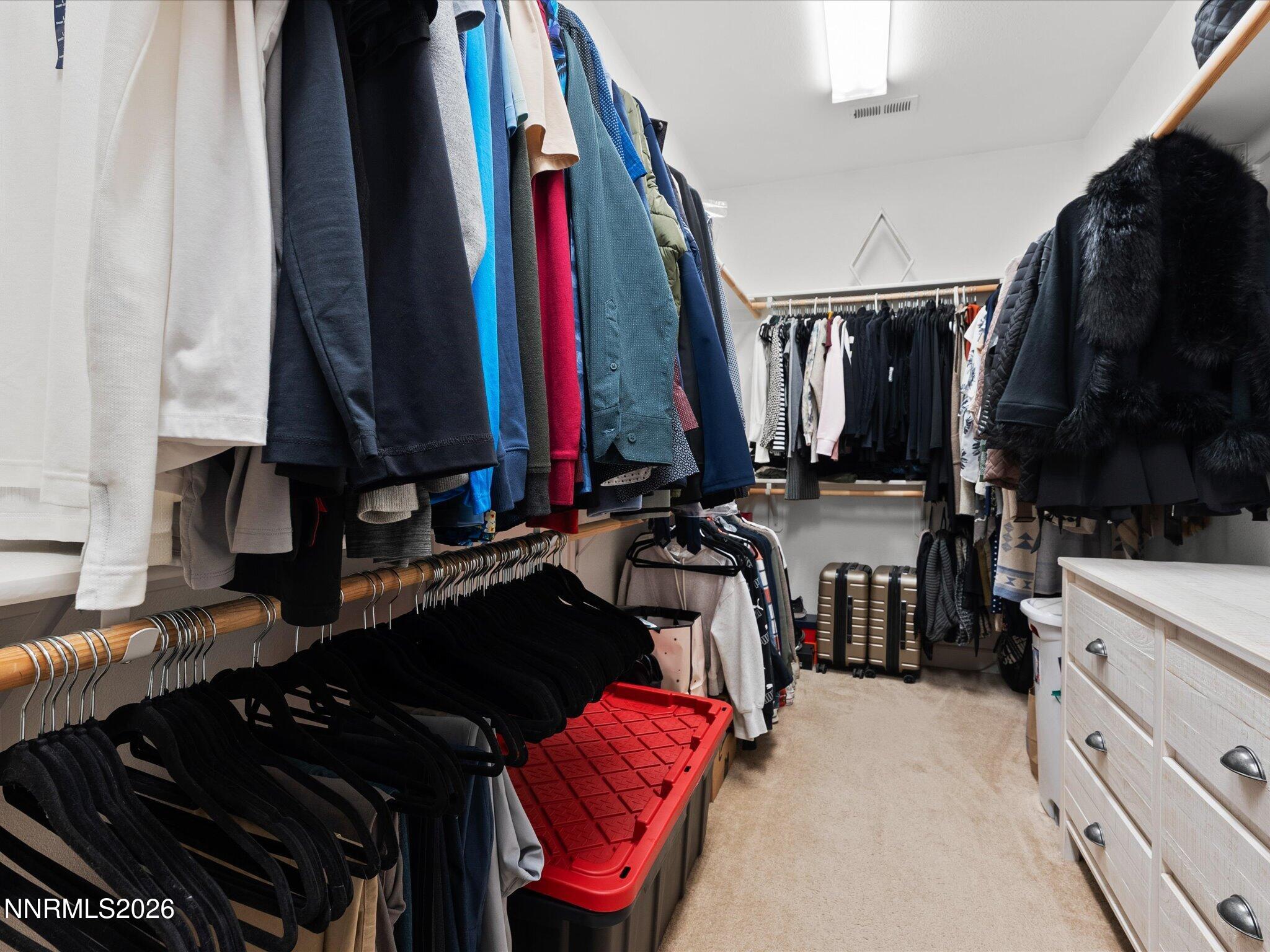 9803 Ash Meadow Drive Reno, NV 89521 - Photo 27 of 56 a view of walk in closet with clothes and shoes
