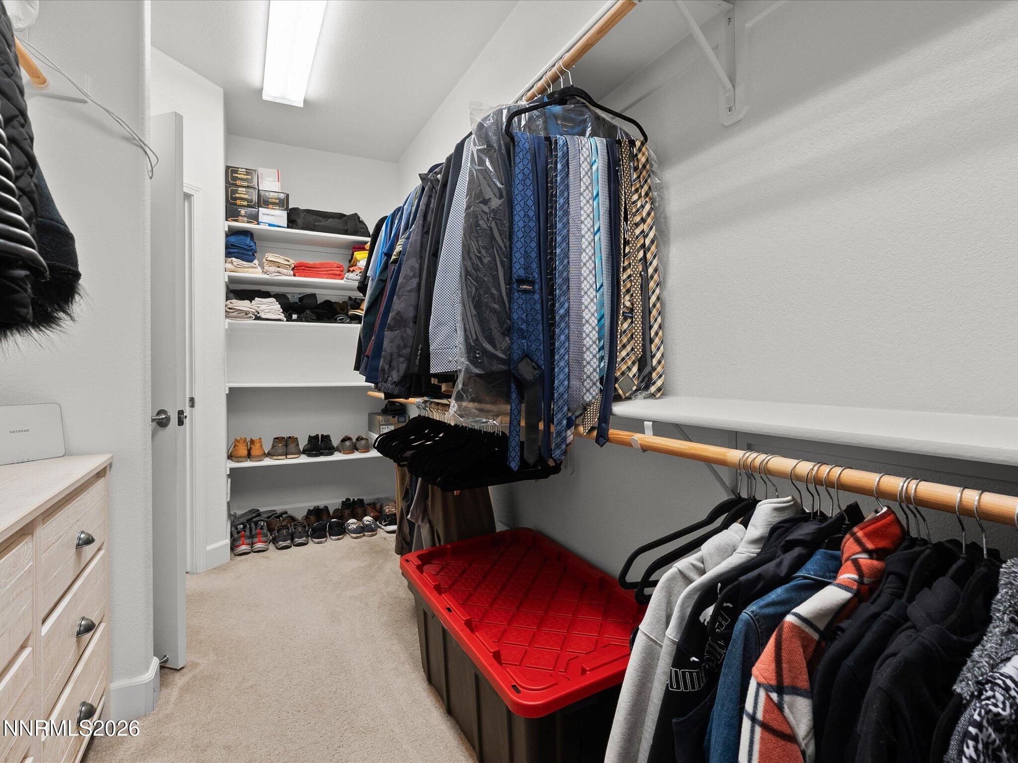 9803 Ash Meadow Drive Reno, NV 89521 - Photo 28 of 56 a view of walk in closet with clothes and shoes