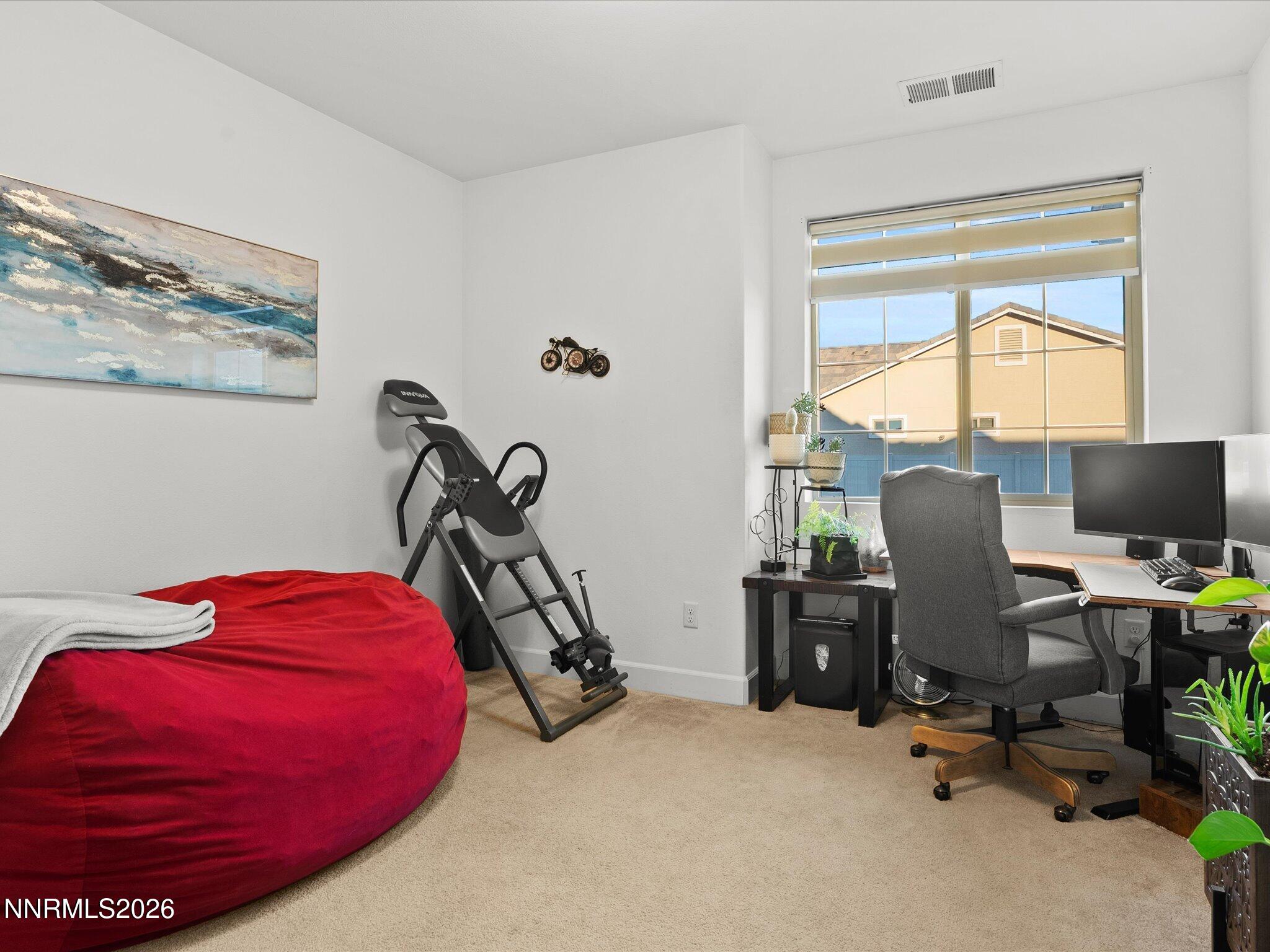 9803 Ash Meadow Drive Reno, NV 89521 - Photo 35 of 56 a view of a workspace with furniture and a window