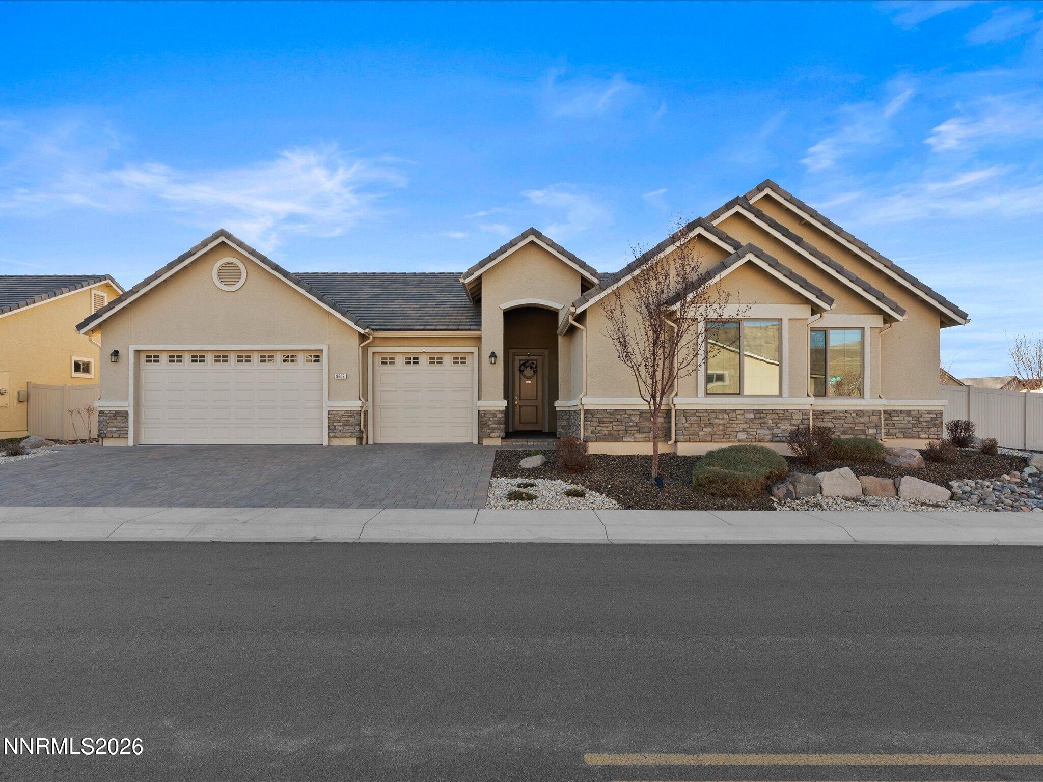 9803 Ash Meadow Drive Reno, NV 89521 - Photo 5 of 56 a front view of a house with a yard