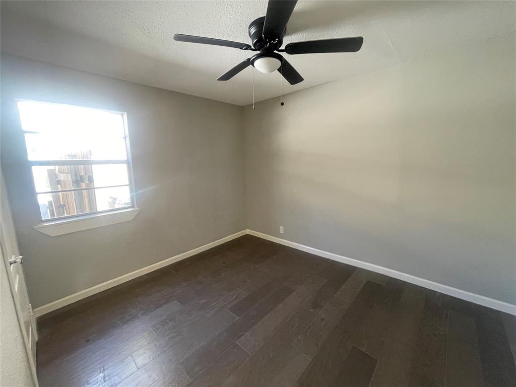 203 Broad Street McKinney, TX 75069 - Photo 15 of 19 an empty room with a window and a fan