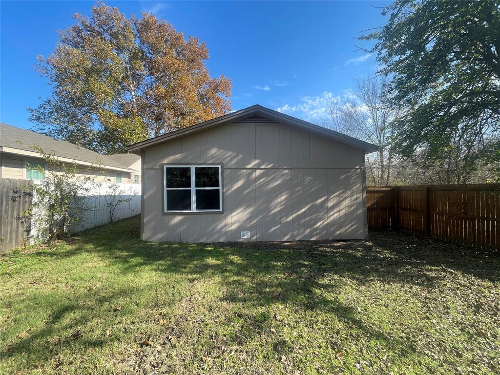 203 Broad Street McKinney, TX 75069 - Photo 17 of 19 a backyard of a house with lots of green space