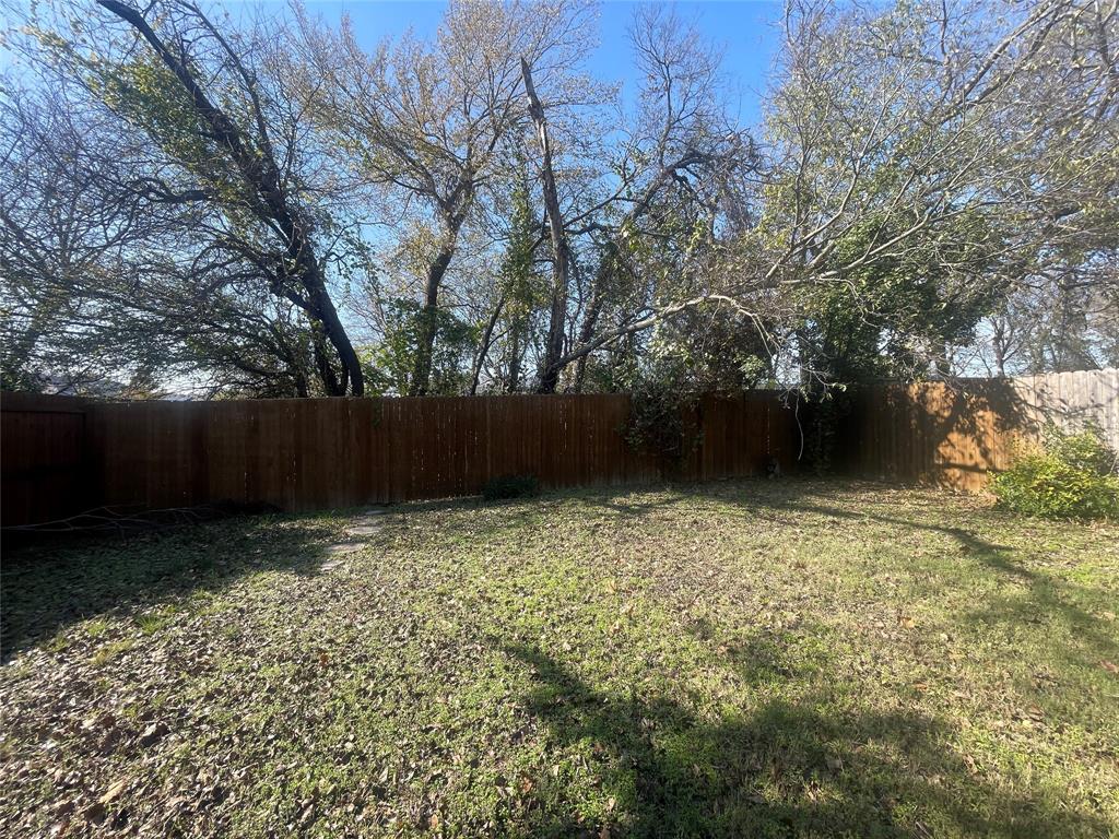 203 Broad Street McKinney, TX 75069 - Photo 18 of 19 a view of backyard with green space
