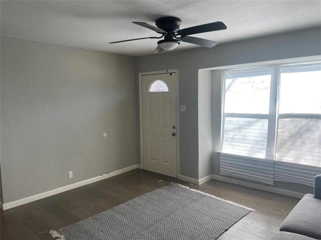 203 Broad Street McKinney, TX 75069 - Photo 6 of 19 a view of an empty room with a window