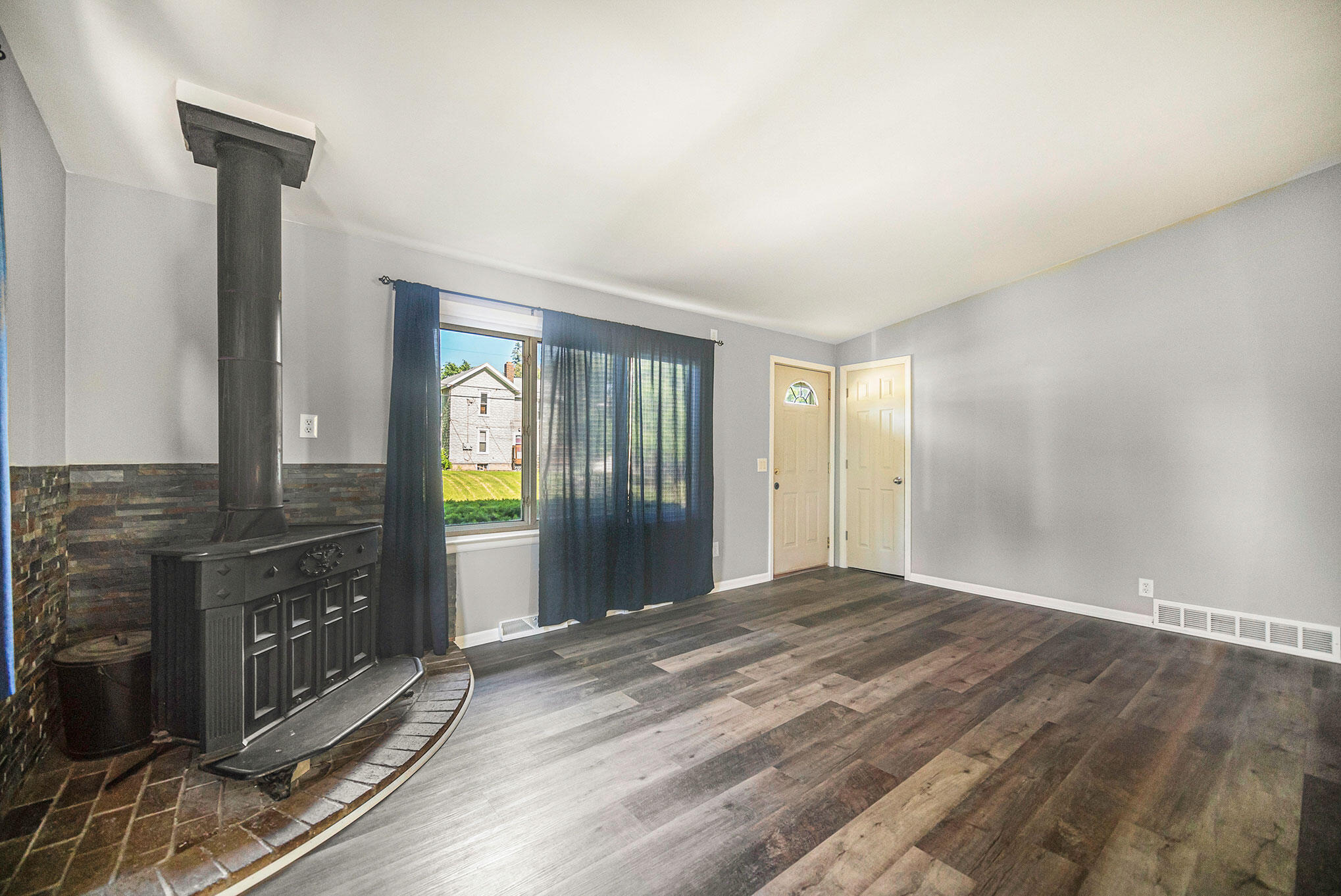 214 Teft Road Spring Arbor, MI 49283 - Photo 8 of 27 Wood burner in the living room