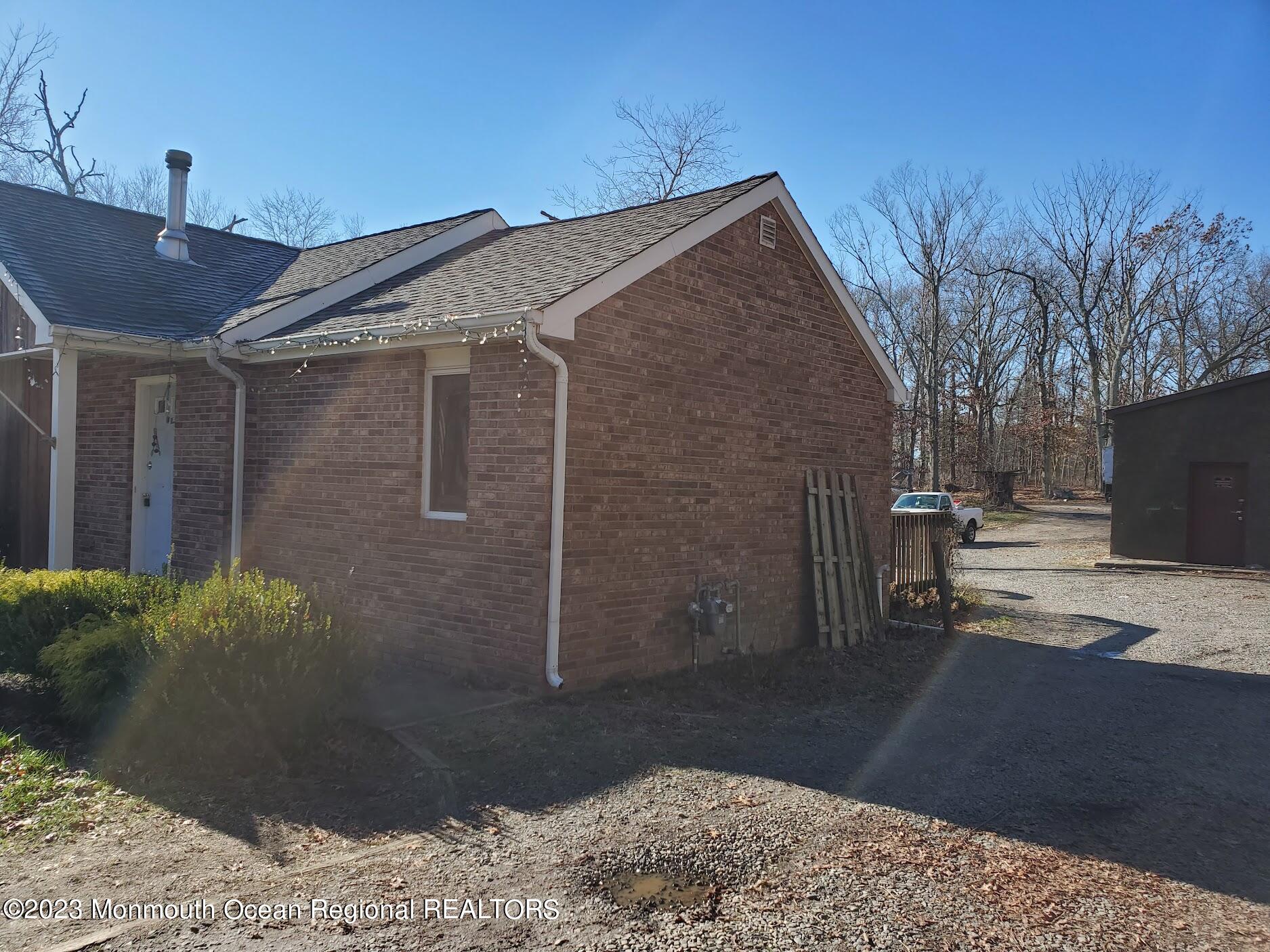 16 Pinewood Road Howell, NJ 07731 - Photo 3 of 28 a view of a backyard