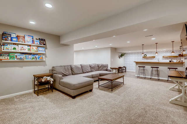 612 Ridgeview Lane Sugar Grove, IL 60554 - Photo 22 of 28 a living room with furniture and a book shelf