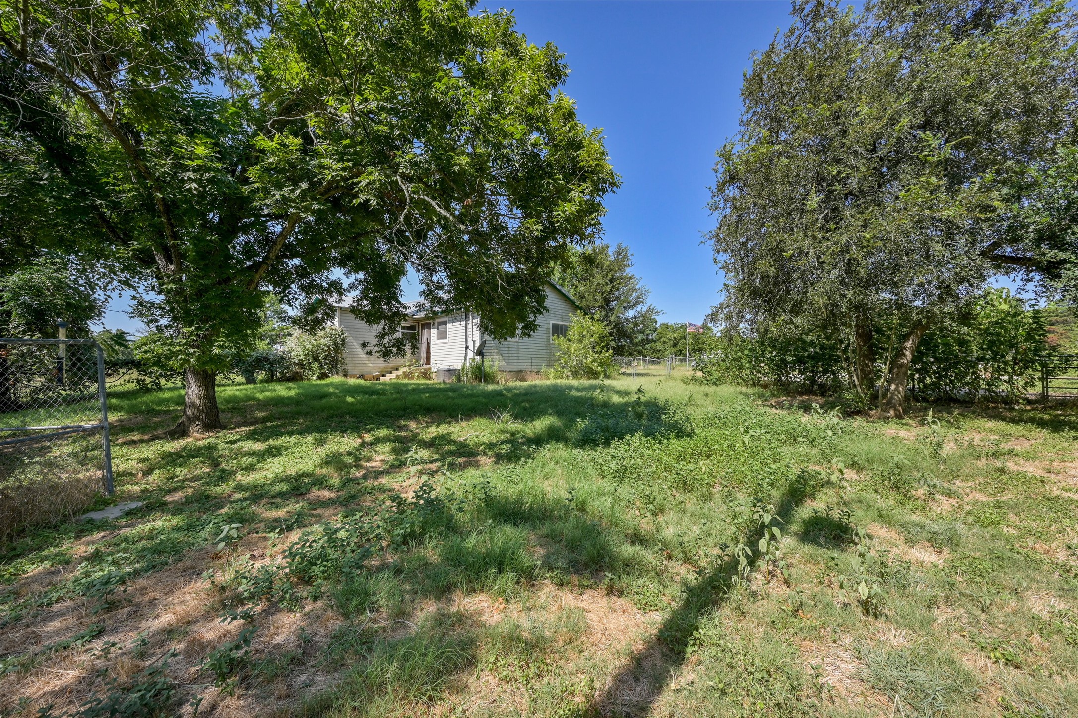 681 County Road 474 Elgin, TX 78621 - Photo 23 of 37 a view of a lush green space