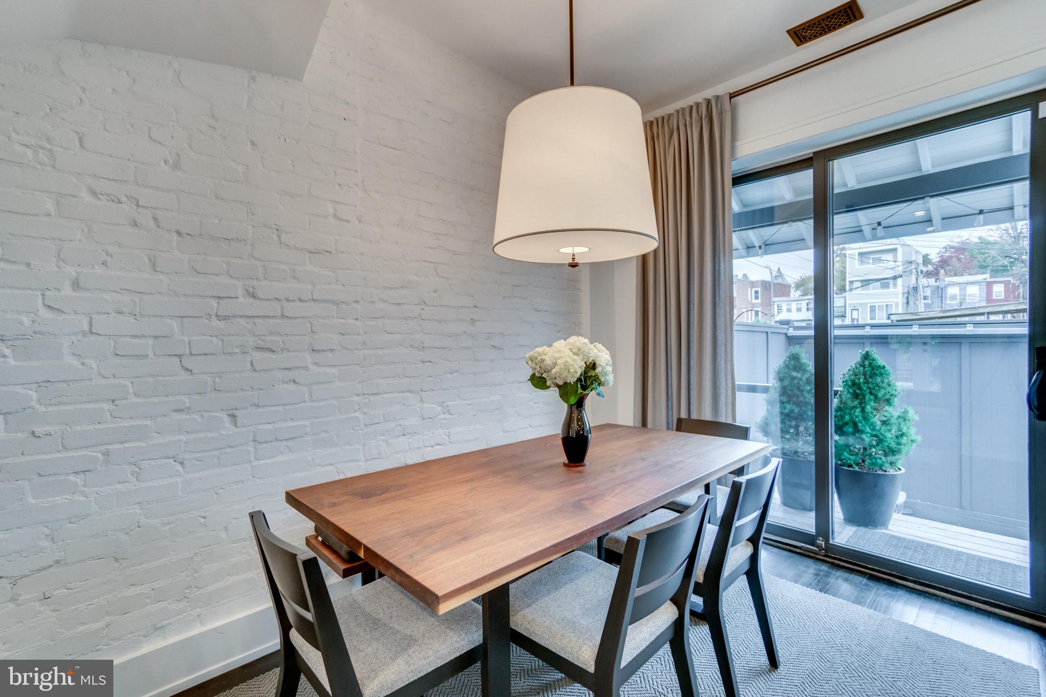 1009 Irving Street Northwest Washington, DC 20010 - Photo 15 of 33 Bright dining space with modern charm.
