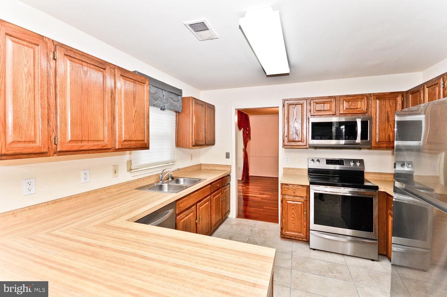 17 Coachlamp Court Silver Spring, MD 20906 - Photo 16 of 42 Kitchen with Stainless Steel Appliances
