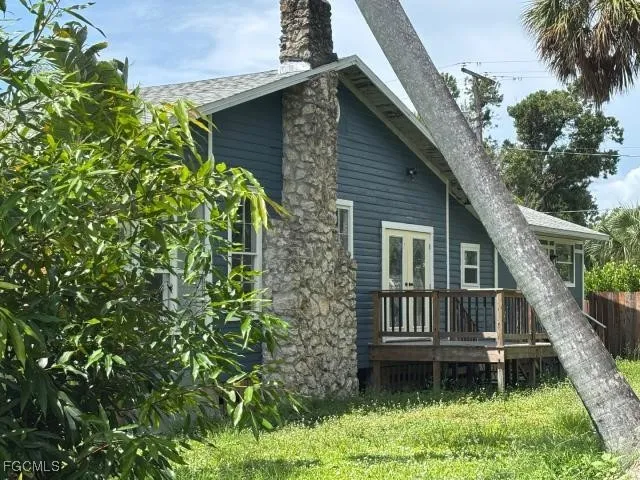 a backyard of a house with lots of green space